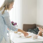 A warm family moment with a mother and daughter sharing breakfast at home.